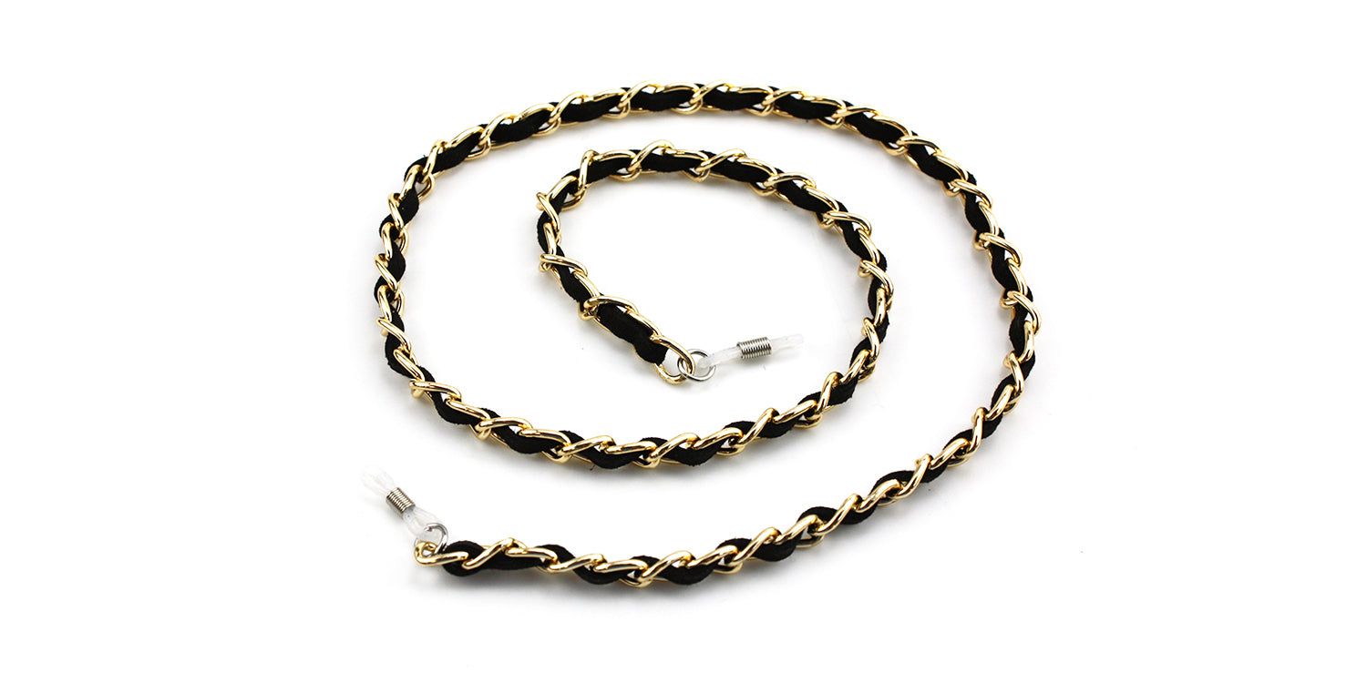 Zwart en goudkleurig brillenkoord, gevlochten design. Einden met lussen voor bevestiging aan brilpoten. Op witte achtergrond.