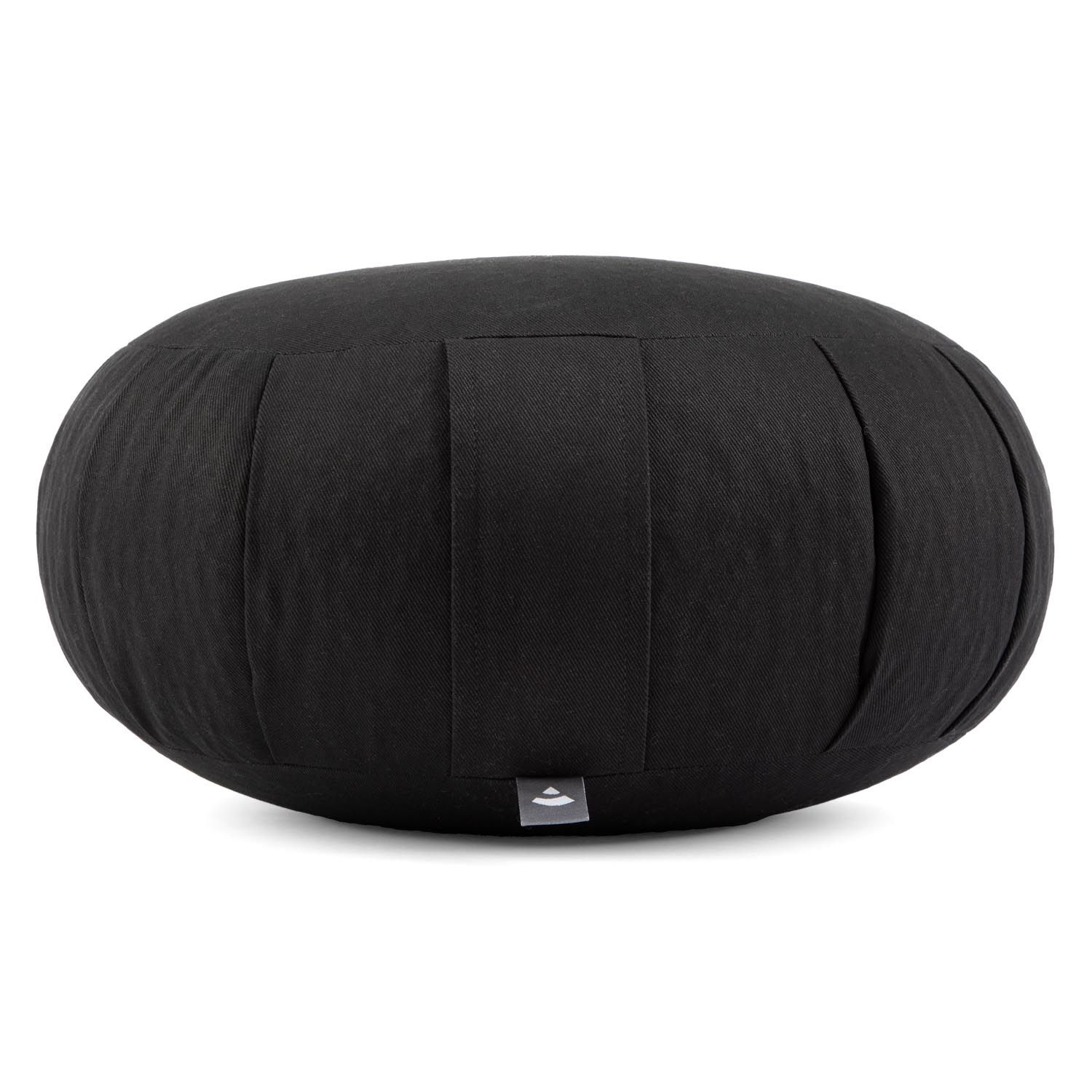 Coussin de méditation ovale noir. Revêtement en tissu plissé. Petit logo sur le côté. Zafu.