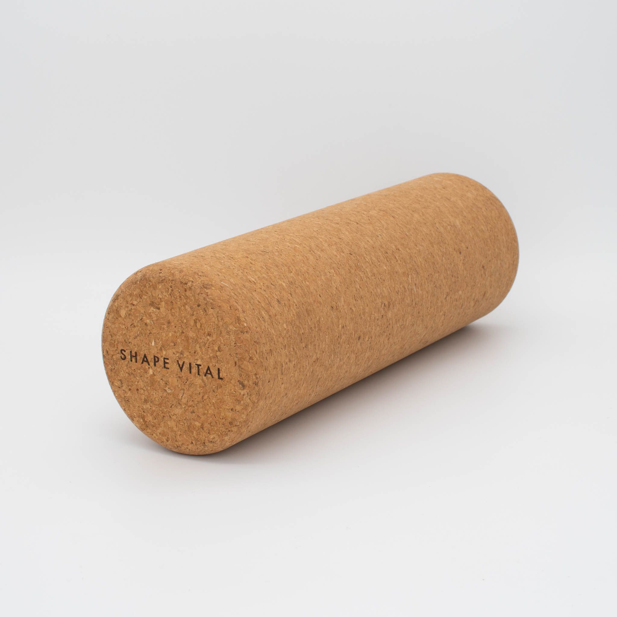 Rouleau de fascia en liège. Cylindrique, marron. "SHAPE VITAL" imprimé sur le côté.