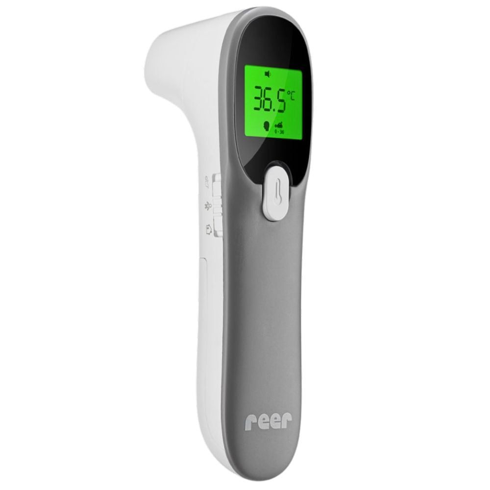 Thermomètre infrarouge gris et blanc avec affichage numérique. Affiche 36,5°C. Marque : reer.