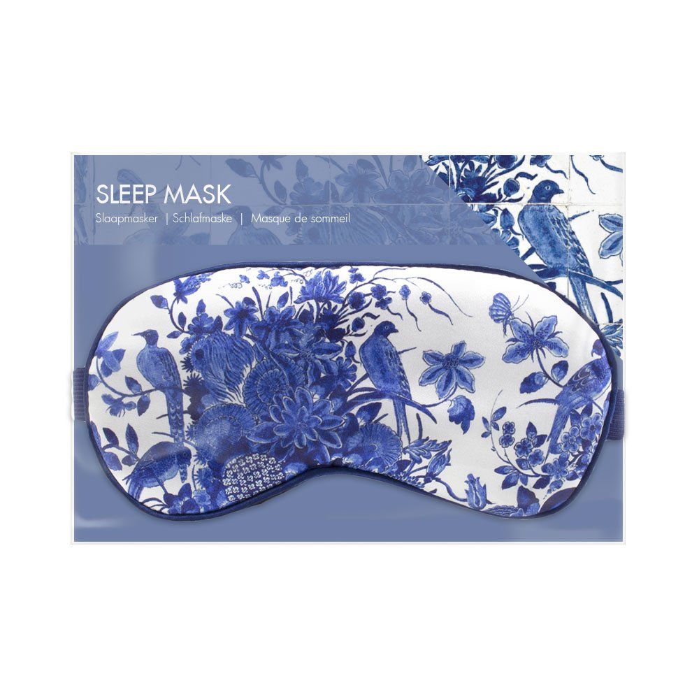 Slaapmasker in verpakking. Blauw-wit bloemen- en vogelpatroon. Tekst: Sleep Mask, Schlafmaske, Masque de sommeil.