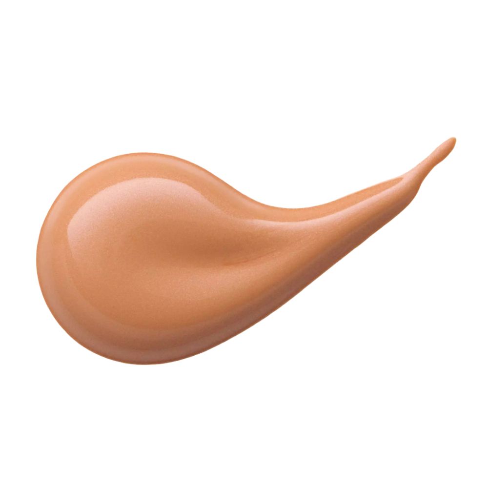 Éclaboussure de correcteur liquide. Couleur orange clair. Forme : allongée, en forme de goutte.