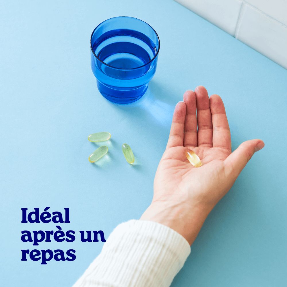 Deux capsules d'huile de poisson Arctic Blue Oméga 3 et une échelle pour indiquer la taille.