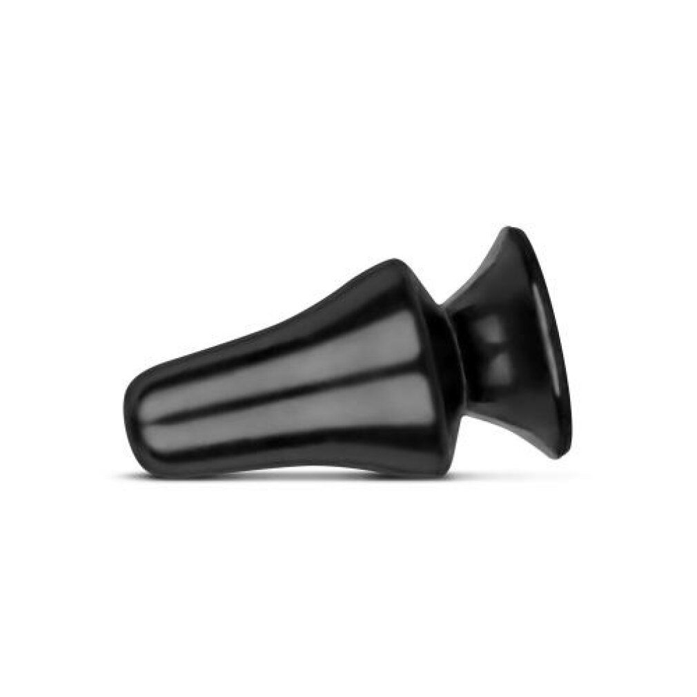 Plug anal noir couché, avec une base large et une pointe conique.