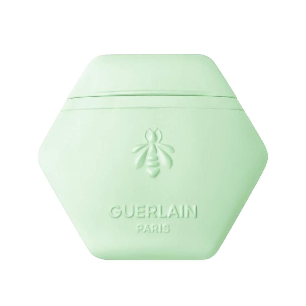 Contenant hexagonal vert clair avec abeille en relief et inscription Guerlain Paris.