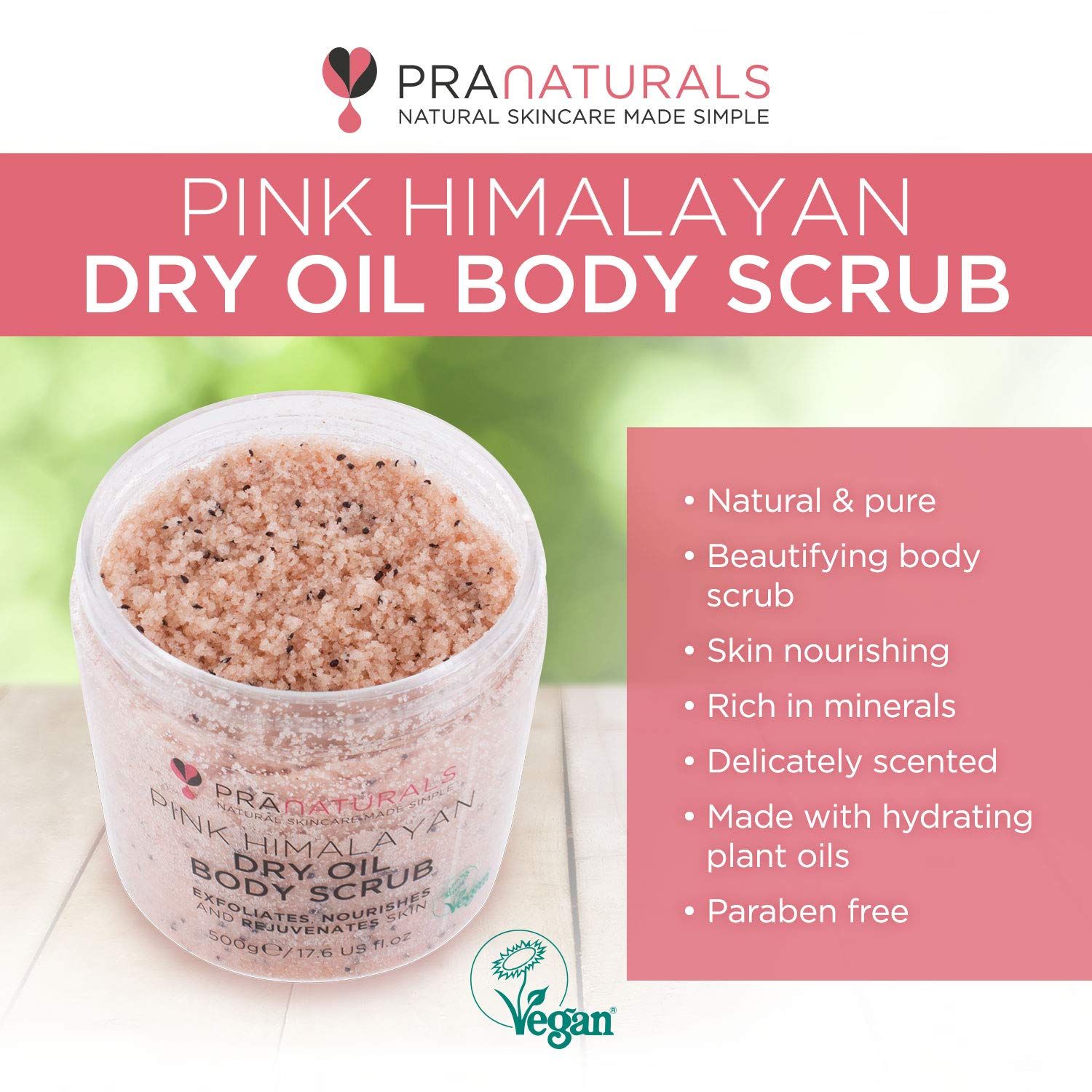 PraNaturals bodyscrub in een open pot. Tekst: Pink Himalayan Dry Oil Body Scrub. Vegan zegel. Op roze achtergrond met tekst.