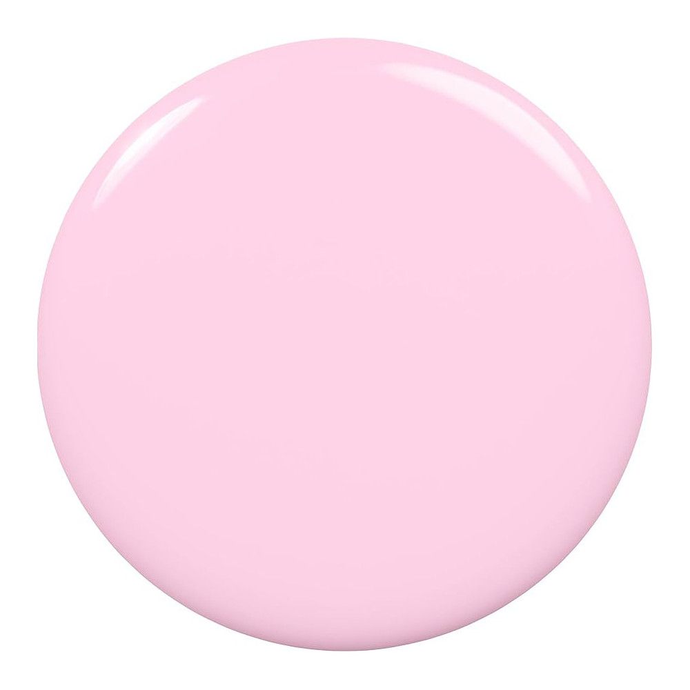 Vlek van lichtroze nagellak. Ronde vorm, glanzend oppervlak.