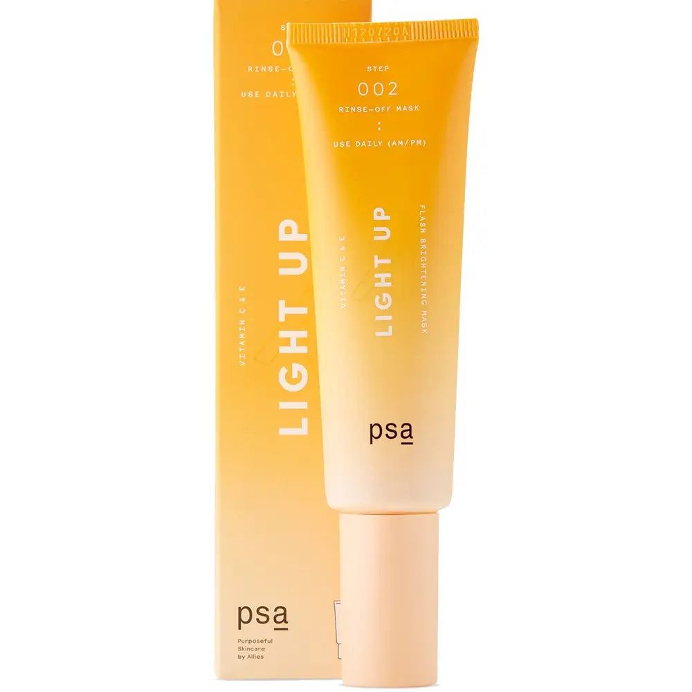 Masque éclaircissant à la vitamine C PSA Light Up à côté de son emballage orange.