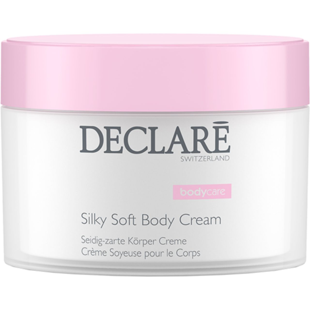 Pot de crème avec couvercle rose. Inscription: DECLARÉ SWITZERLAND, Silky Soft Body Cream. Texte en allemand et français.