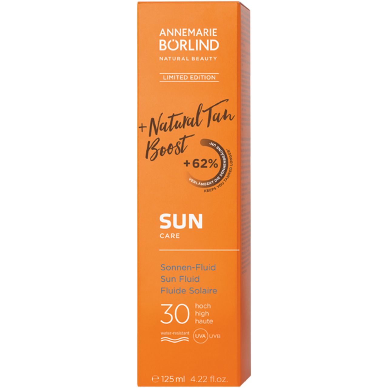 Emballage orange avec nom du produit et SPF 30. Texte: Natural Tan Boost, Sun Care, Fluiide Solaire, 125 ml.