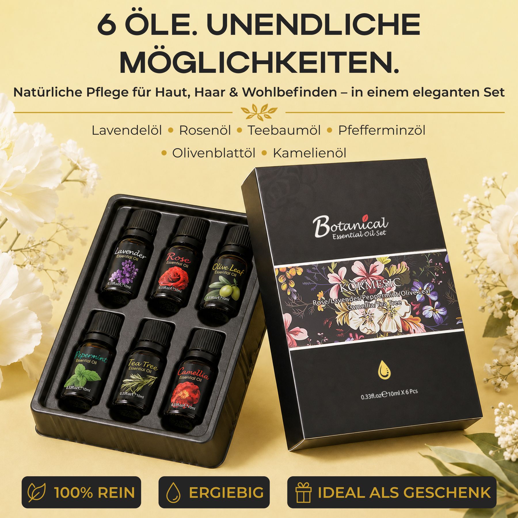 Six petites bouteilles noires d'huiles essentielles dans un plateau noir, à côté d'une boîte cadeau noire à motif floral.