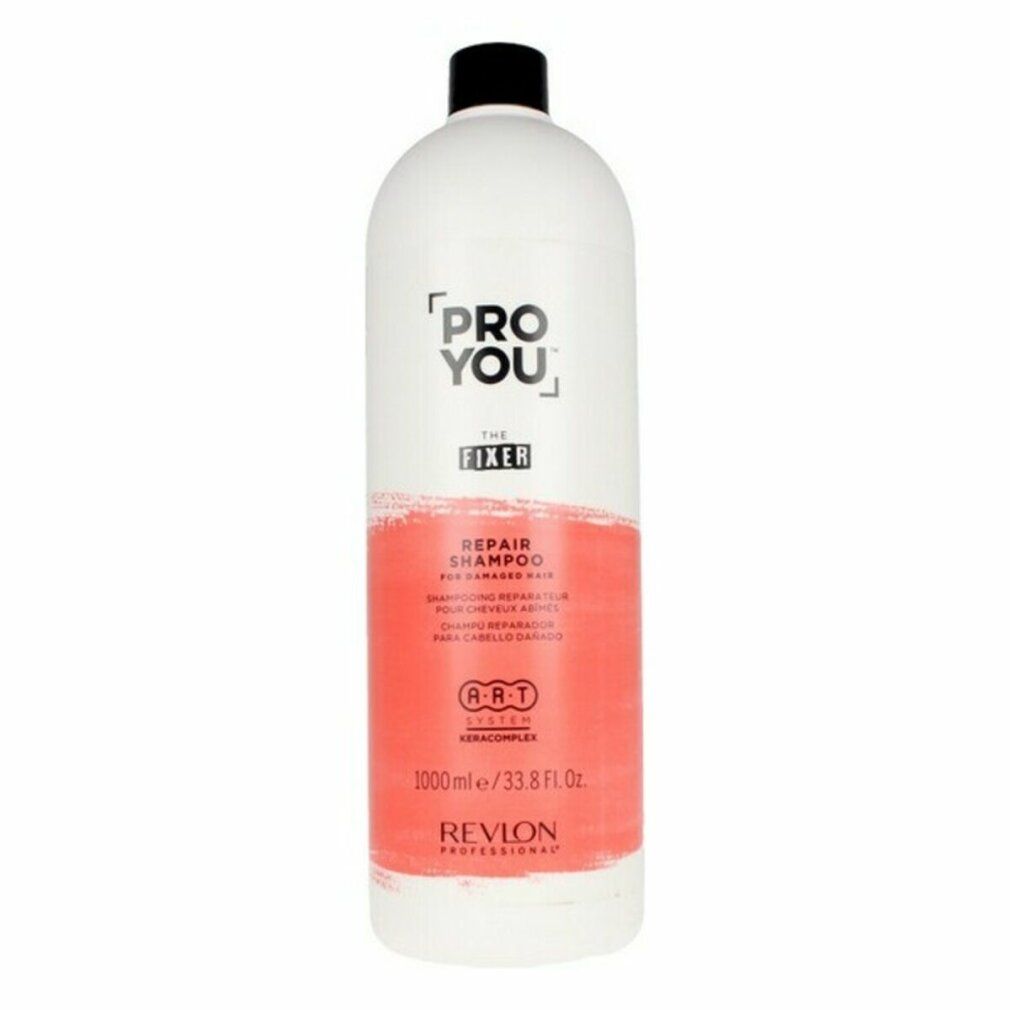 Witte fles met zwarte dop. Opschrift: Pro You The Fixer Repair Shampoo. Rode kleurvlak. Revlon Professional.