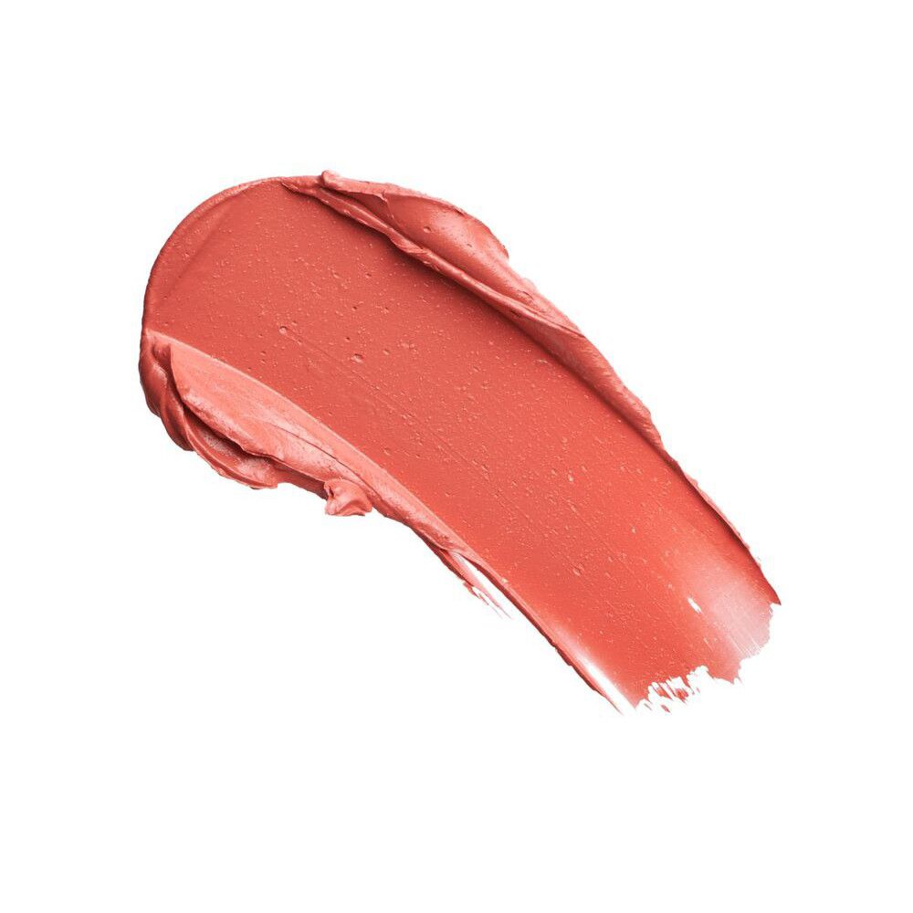 Échantillon de rouge à lèvres pêche corail. Texture brillante. Fond blanc.