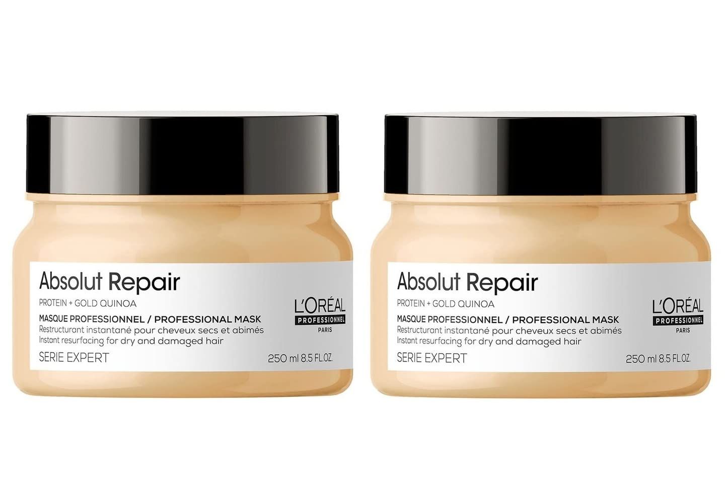 Twee potten L'Oréal Professionnel Absolut Repair Gold Maschera Professionale. Beige potten met zwarte deksels, labels.