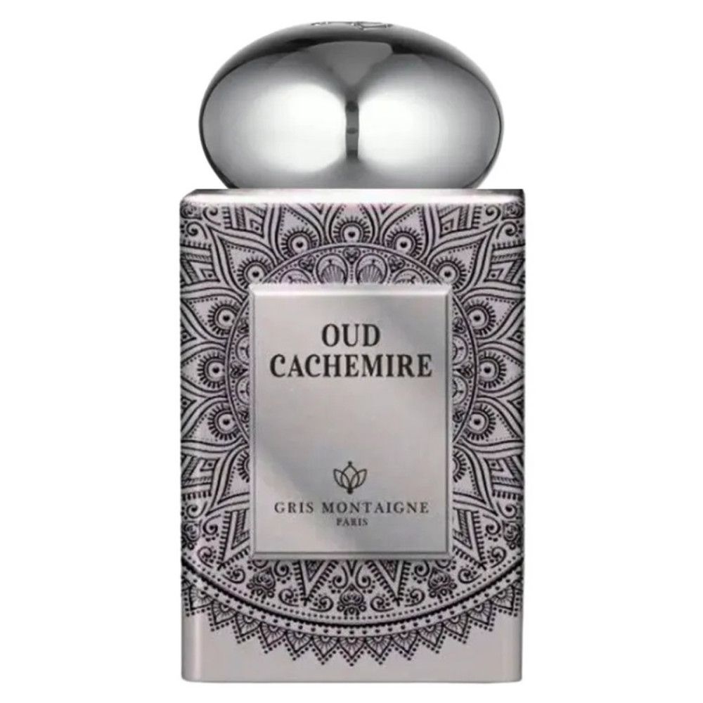 Flacon de parfum argenté avec bouchon. Écriture noire Oud Cachemire. Gris Montaigne Paris. Motif décoratif.