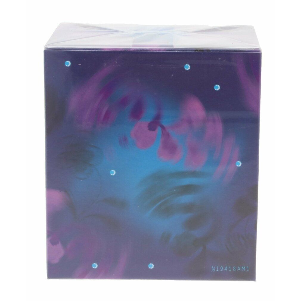 Emballage de Midnight Fantasy. Fond bleu foncé avec éléments floraux et points bleus.