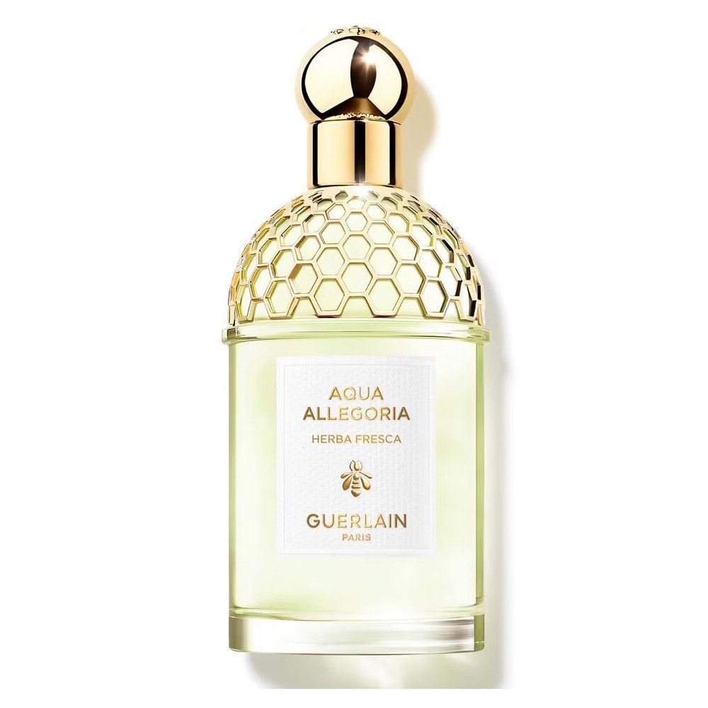 Flacon Guerlain Aqua Allegoria Herba Fresca. Bouchon doré, étiquette blanche, liquide vert.