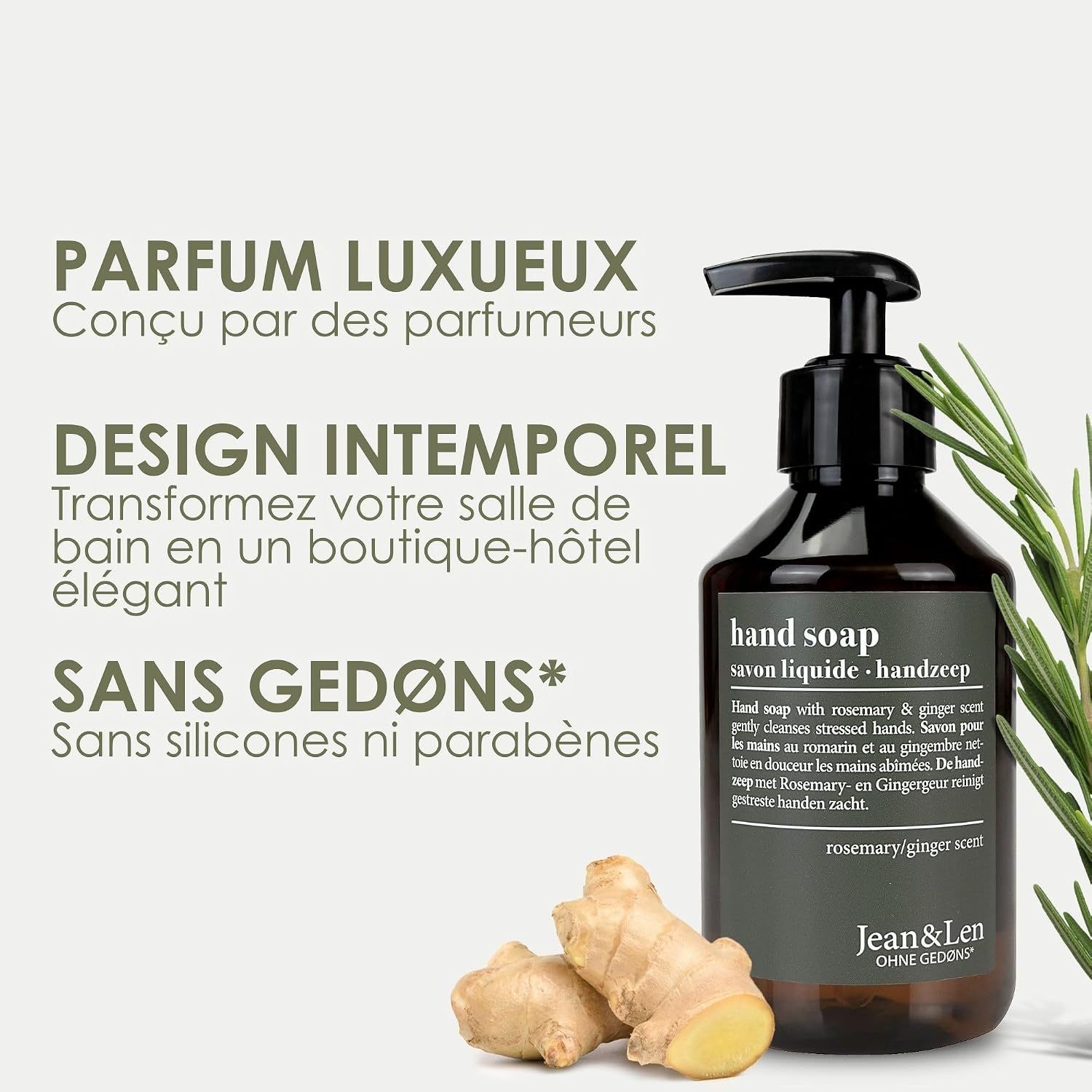 Bouteille foncée de savon liquide, parfum romarin-gingembre, près de gingembre frais et d'une branche de romarin.