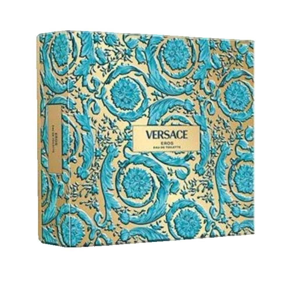 Emballage avec ornements bleu et or. Forme rectangulaire. Texte: Versace Eros Eau de Toilette. Étiquette dorée avec logo.