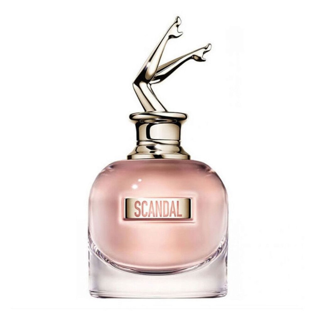 Flacon de parfum avec jambes dorées en bouchon. Inscription "SCANDAL". Liquide rose.