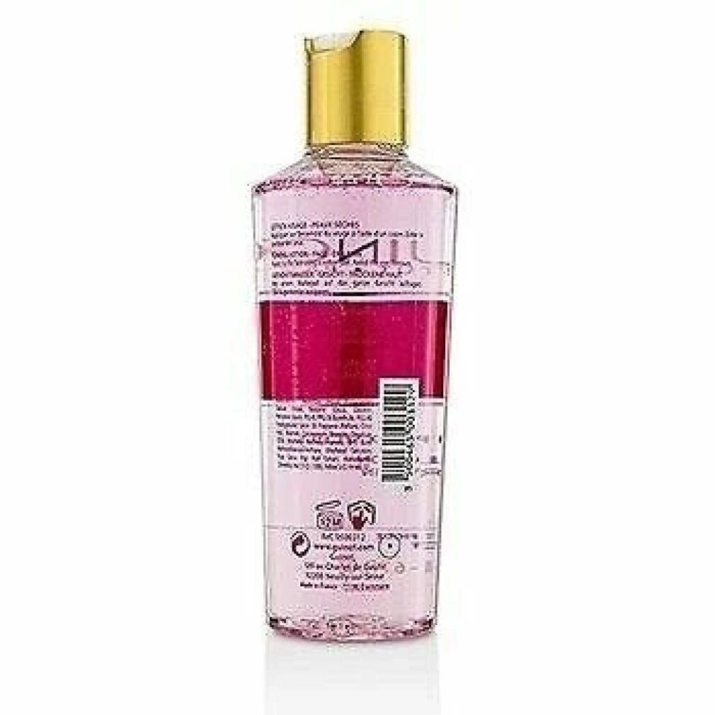 Guinot Hydra Beaute Lotion. Achteraanzicht van de fles. Transparante fles met roze vloeistof, gouden dop. Etiketten.