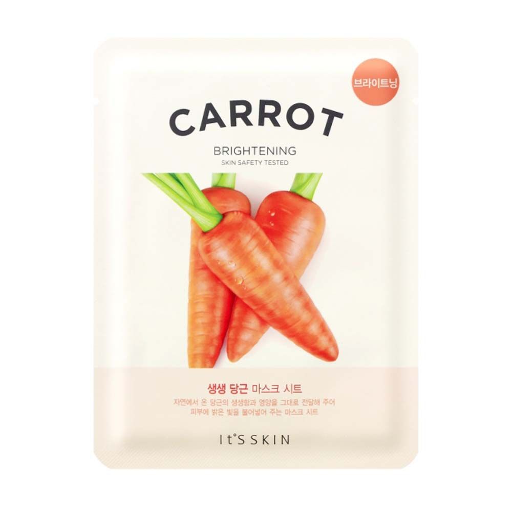 Gezichtsmasker met wortelillustratie. Tekst: CARROT, BRIGHTENING, SKIN SAFETY TESTED. Merk: IT'S SKIN.