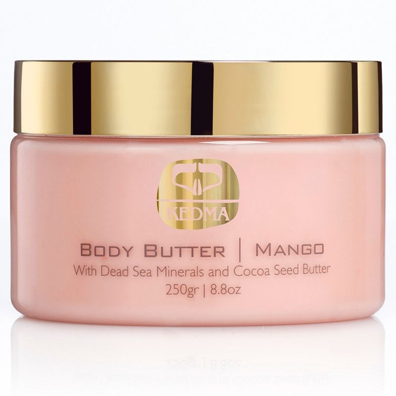 Roze pot met gouden deksel. Opschrift: KEDMA, BODY BUTTER, MANGO. Bevat mineralen uit de Dode Zee en cacaoboter. 250gr/8.8oz.