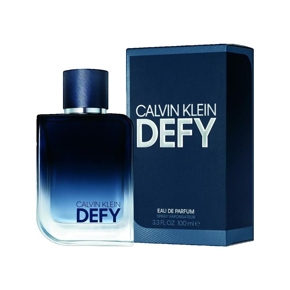 Donkerblauwe parfumfles en doos met opschrift CALVIN KLEIN DEF. Fles met blauwe dop. Doos met tekst.