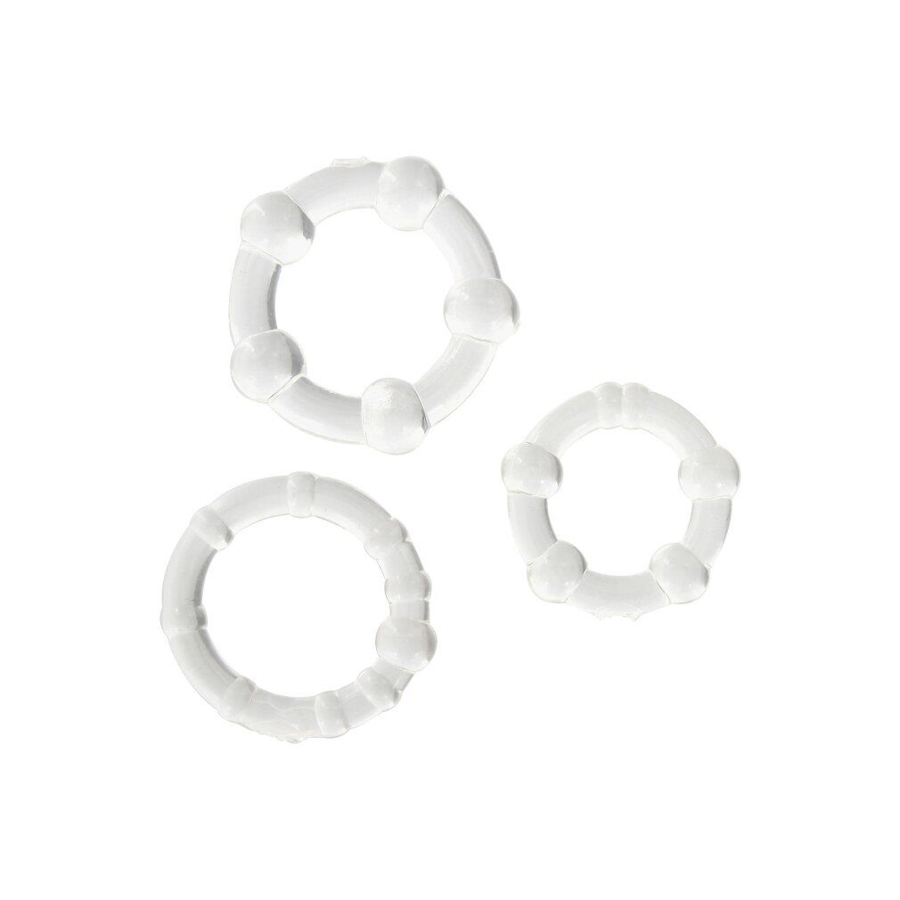 Trois anneaux de pénis transparents de différentes tailles et designs.