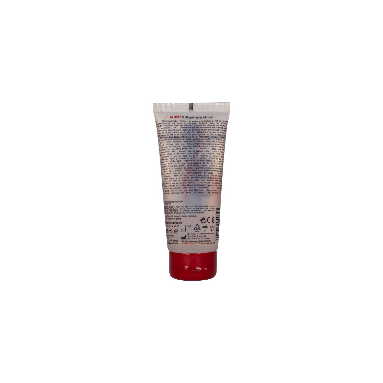 Dos d'un tube transparent avec bouchon rouge. Texte en plusieurs langues.