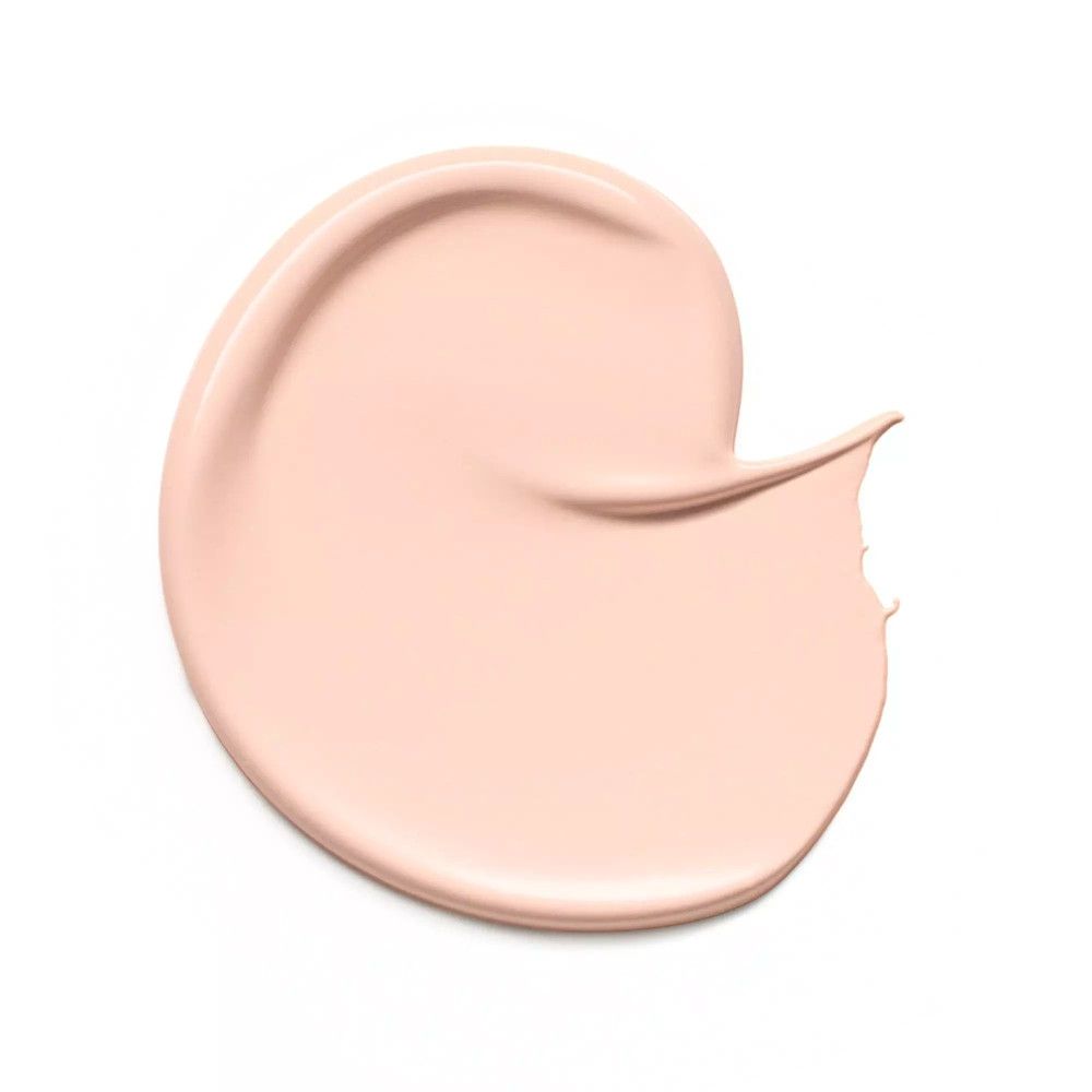 Trait de correcteur brun clair sur fond blanc. La texture est lisse.