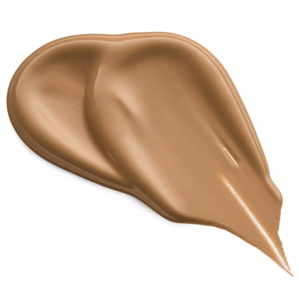 Échantillon de correcteur étalé. Teinte: marron clair. Texture brillante.