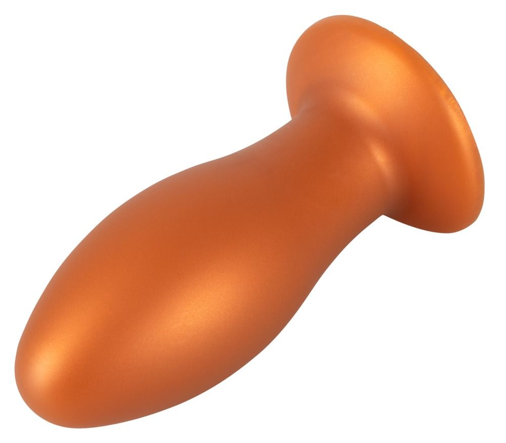 Plug anal orange avec ventouse, présenté couché.