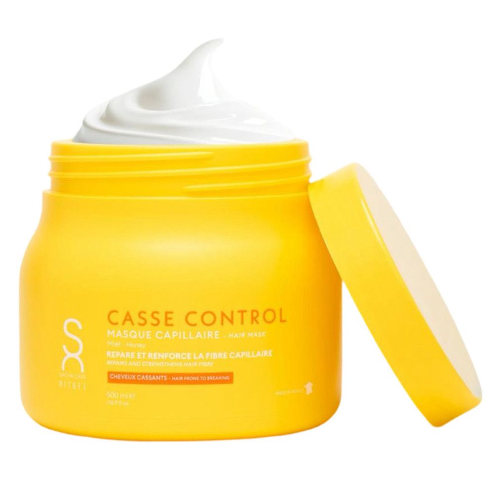Geopende gele pot met witte crème. Tekst: Casse Control, Masque Capillaire, Réparation et Renforce la Fibre Capillaire.