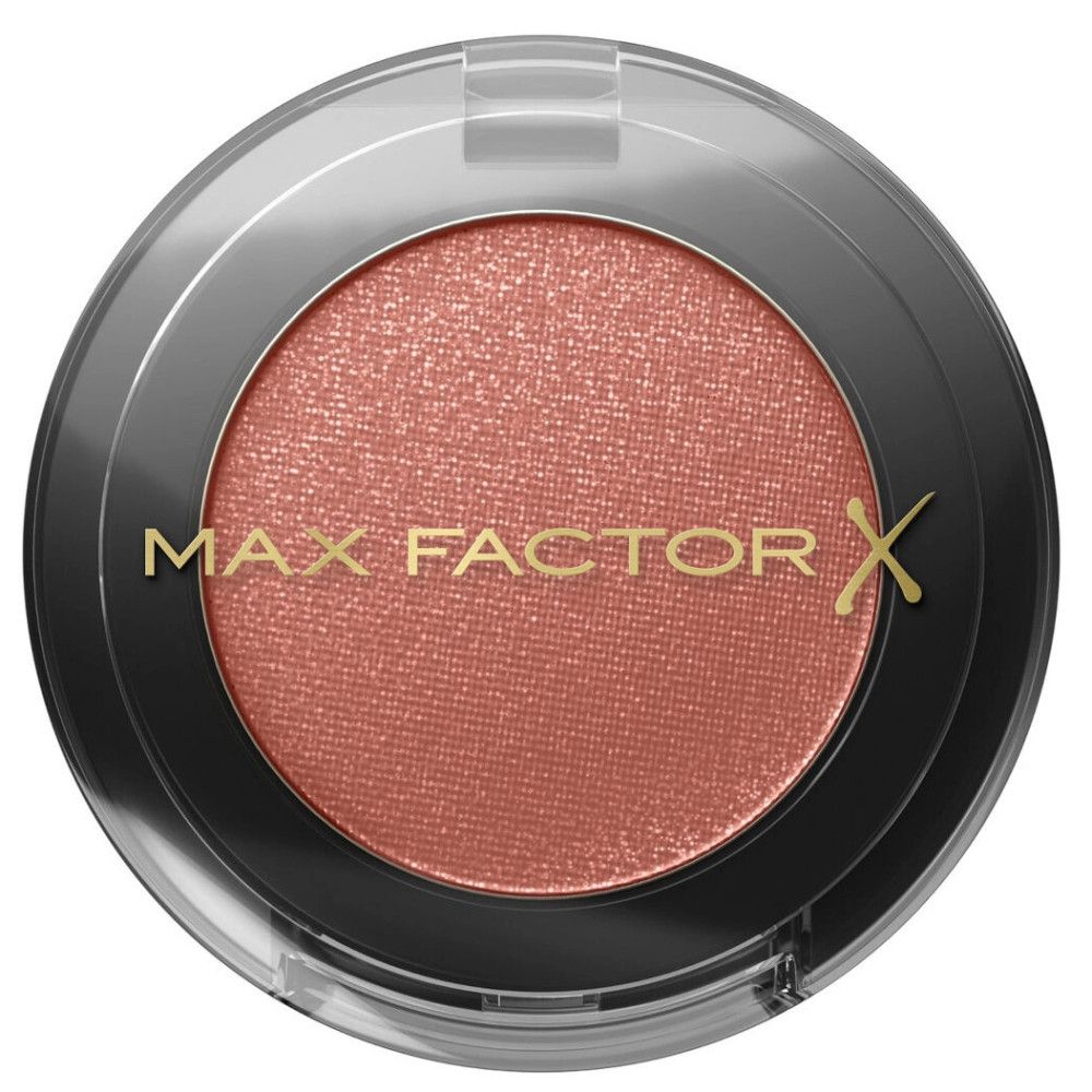 Roze oogschaduw in een zwarte houder met transparant deksel. Op het deksel staat de merknaam Max Factor.