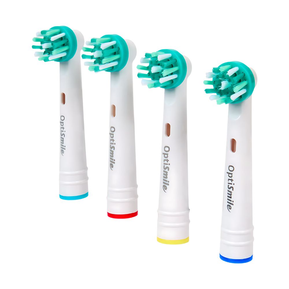 Quatre têtes de brosse OptiSmile X Active avec soies vertes. Anneaux colorés: bleu, rouge, jaune et bleu.