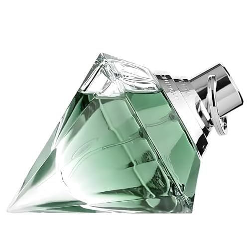 Flacon de parfum en forme de diamant. Liquide vert clair. Fermeture argentée. Inscription sur le bouchon.
