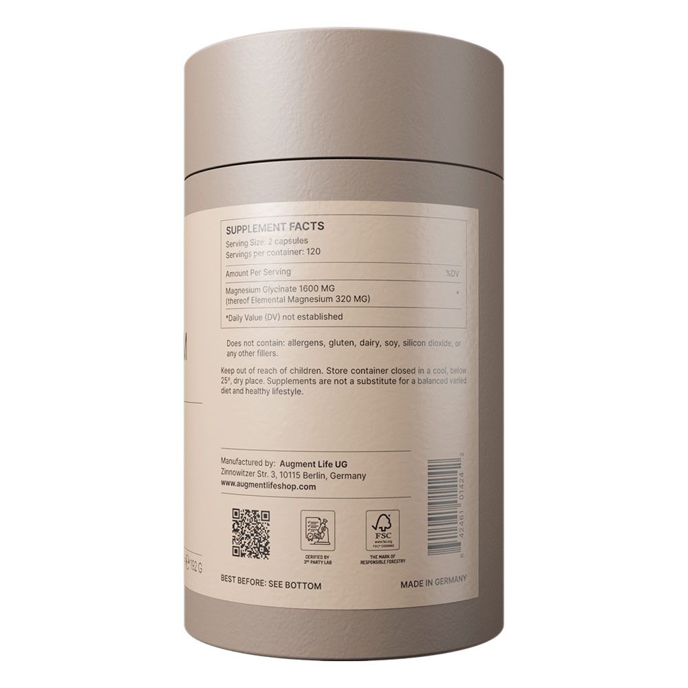 Supplement Facts etiket op cilindrische verpakking met magnesiuminformatie en fabrikantgegevens.