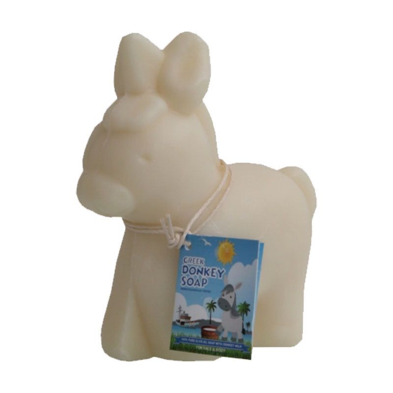 Savon crème en forme d'âne. Étiquette avec texte: Greek Donkey Soap. Cordon autour du cou.
