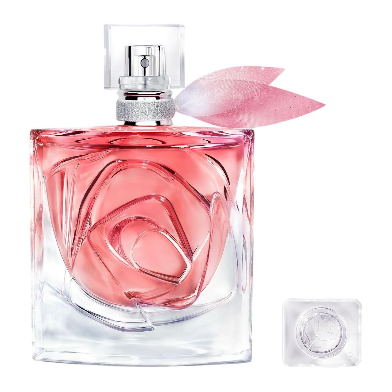 Flacon carré avec motif rose. Vaporisateur transparent et pétale rose. Bouchon à côté.