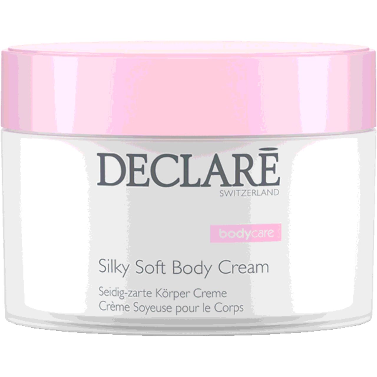 Pot de crème avec couvercle rose. Inscription: DECLARÉ SWITZERLAND, Silky Soft Body Cream. Texte en allemand et français.