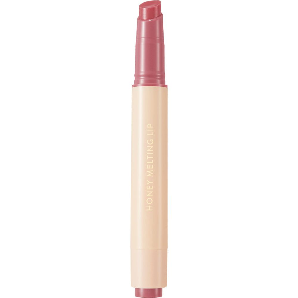 Een enkele lippenstift in een beige huls. Op de huls staat 'HONEY MELTING LIP'.