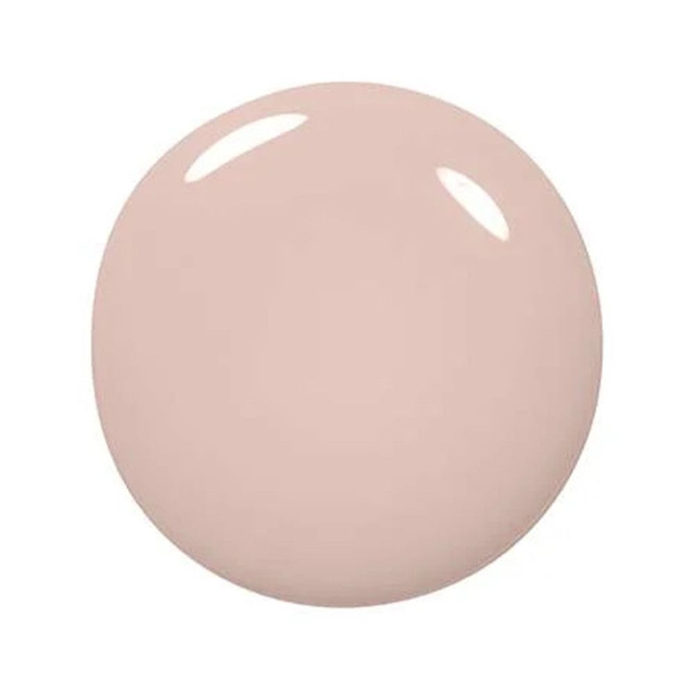Tache ronde de vernis à ongles rose. Surface brillante. Sur fond blanc.