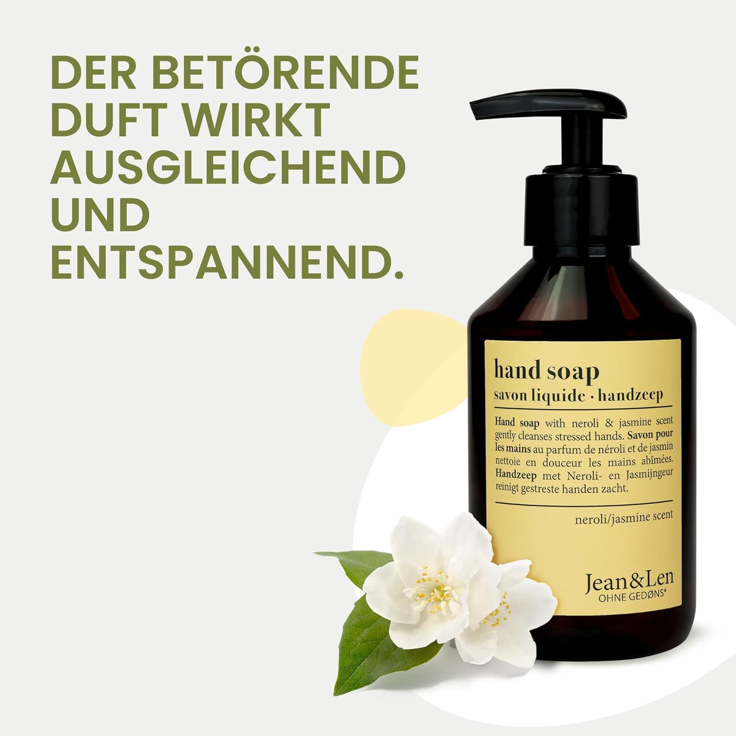 Bruine fles handzeep met zwarte pomp. Opschrift: Hand Soap, Neroli & Jasmin geur, Jean & Len. Met jasmijn bloem.