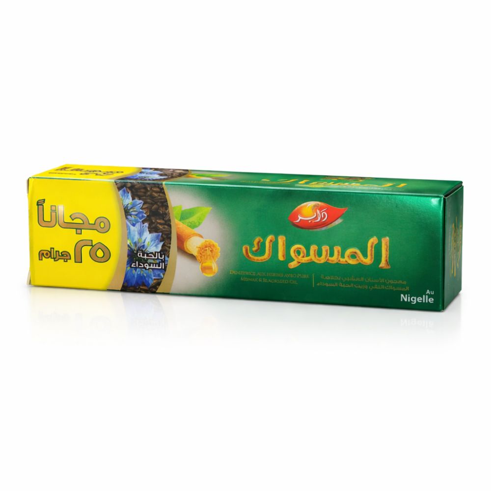 Verpakking, groen-geel, Arabisch schrift. Opschrift: Miswak. Met zwarte komijnolie. Gratis 25g.