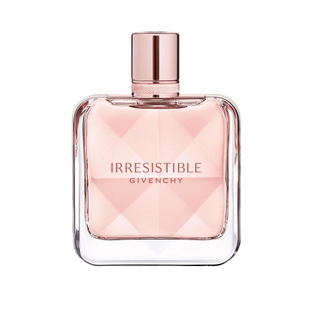 Flacon de parfum rose. Forme carrée avec design facetté. Inscription: Irresistible Givenchy.
