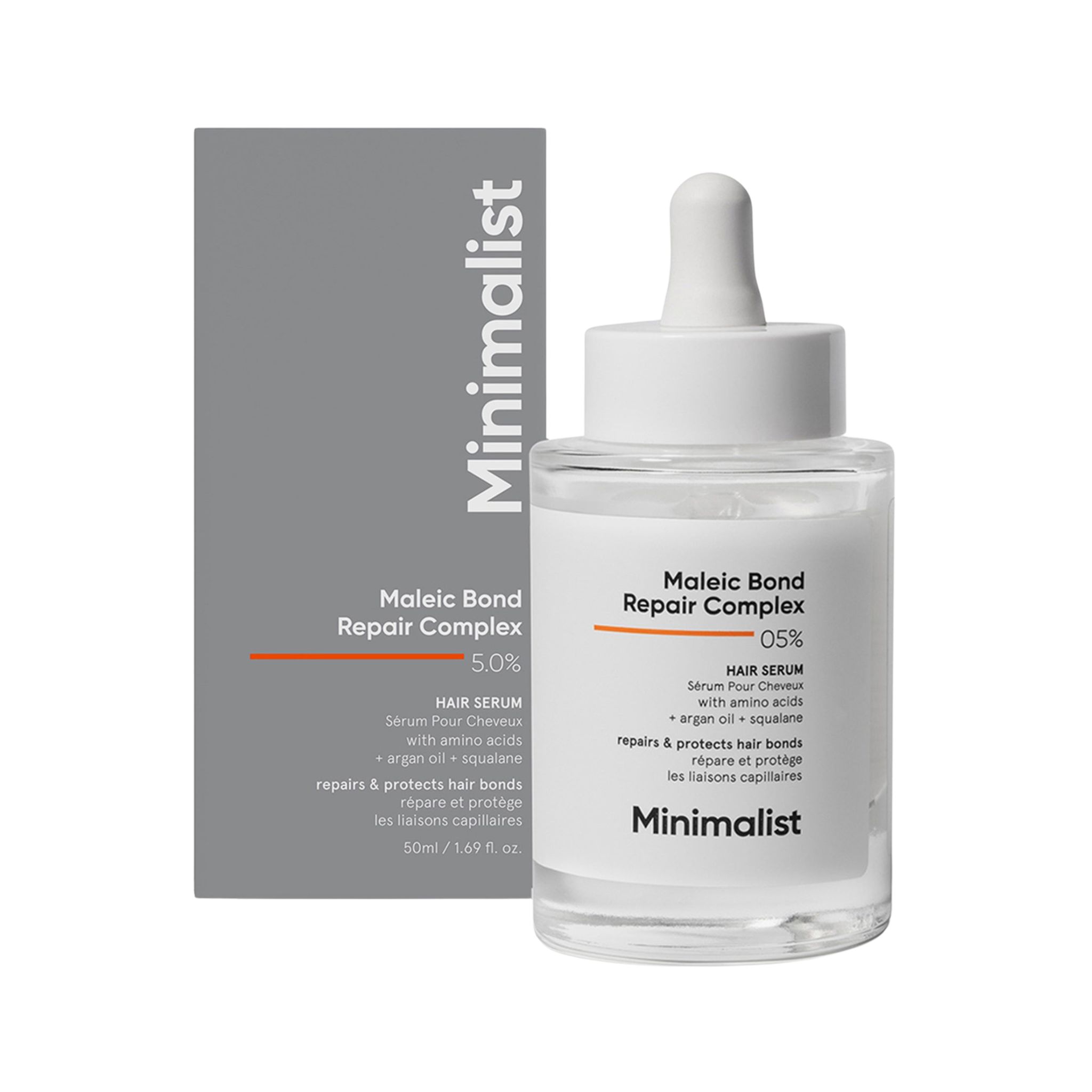 Haarserumfles en doos. Opschrift: Minimalist, Maleic Bond Repair Complex 05%. Bevat arganolie en squalaan. Met pipet.