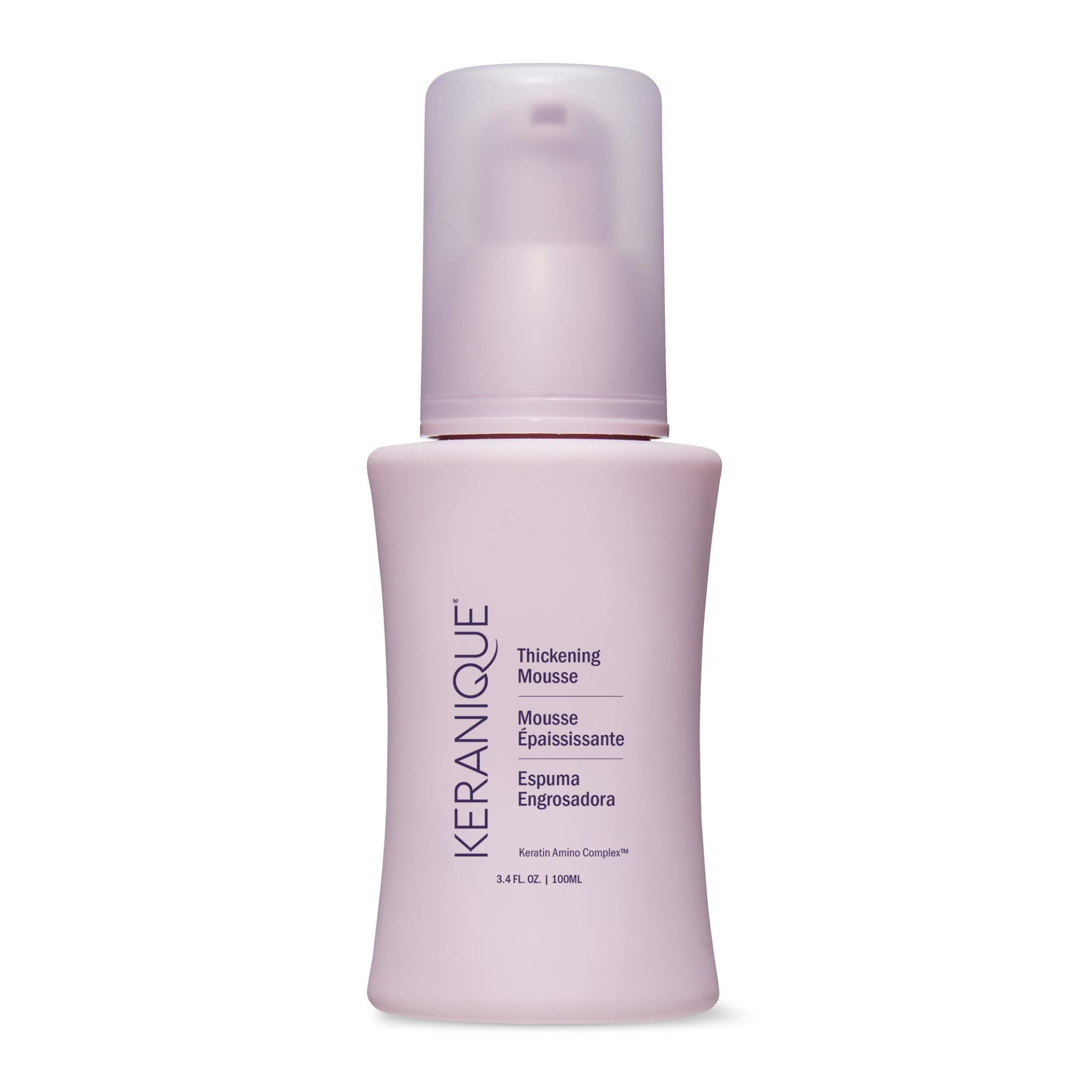 Flesje Keranique Thickening Mousse met pomp. Tekst in het Engels, Frans en Spaans. Roze fles.