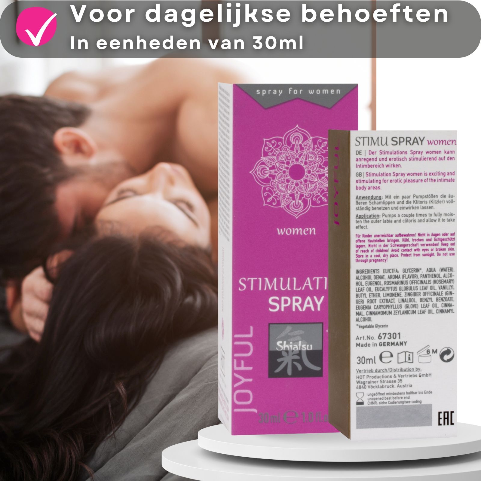 Verpakking en fles. Tekst: Stimulation Spray, Shiatsu. Paar op de achtergrond.