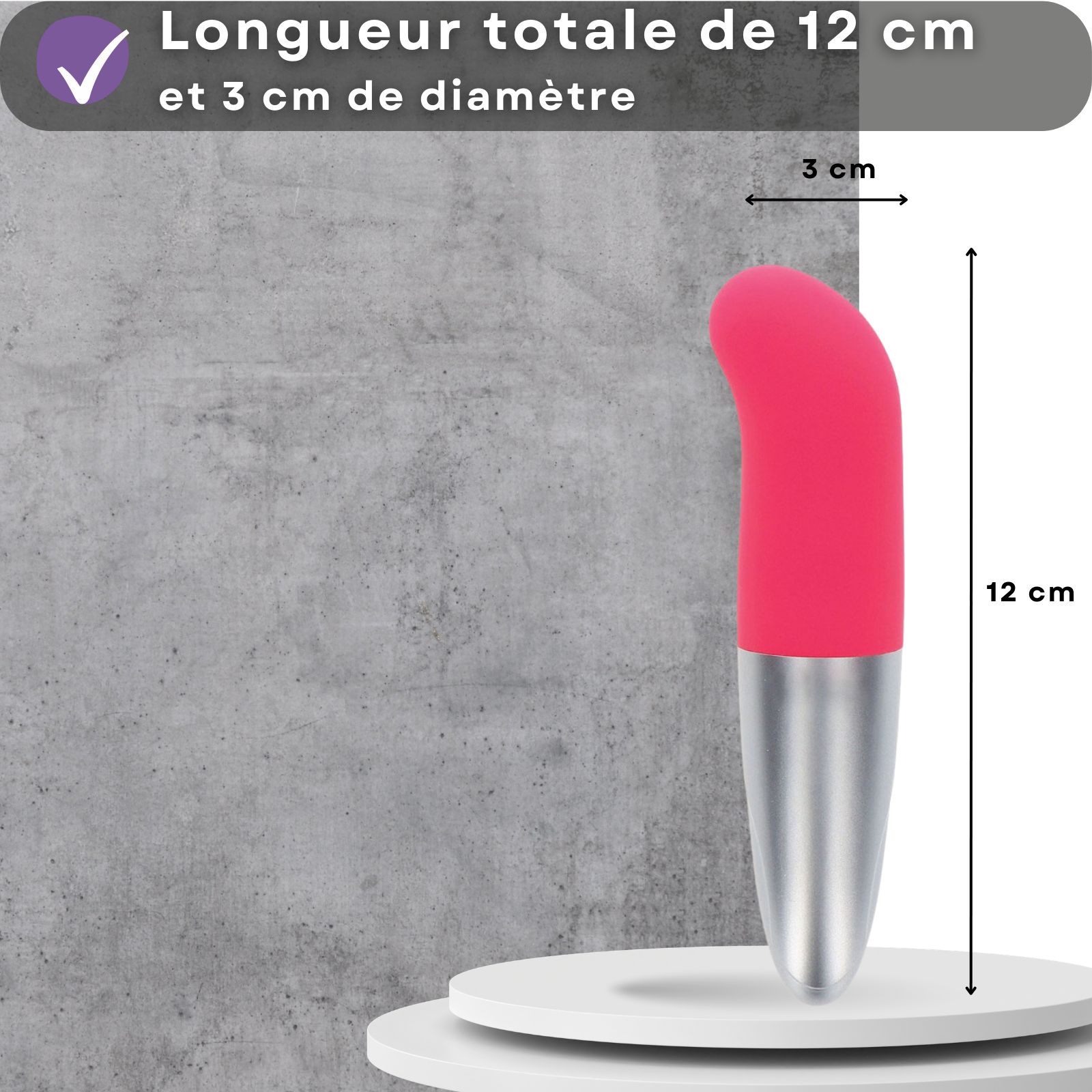 Vibrateur rose et argenté. Longueur 12 cm, diamètre 3 cm. Sur socle.